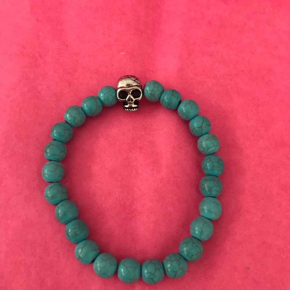 Turquoise bracelet with silver skull charm